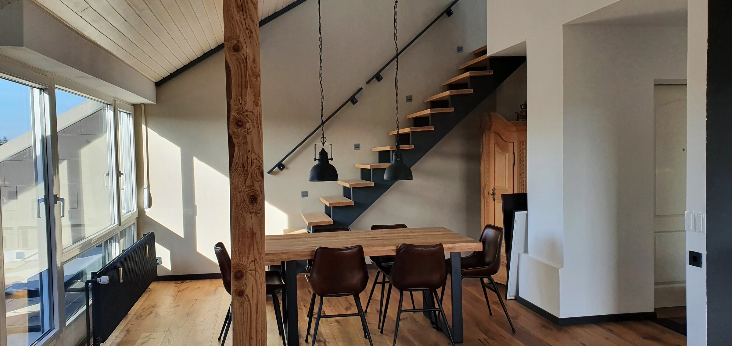 Dining area with stairs up to the bedroom