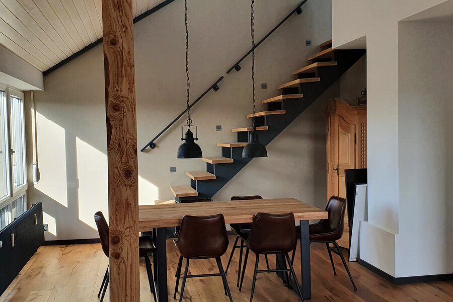 Dining area with stairs up to the bedroom
