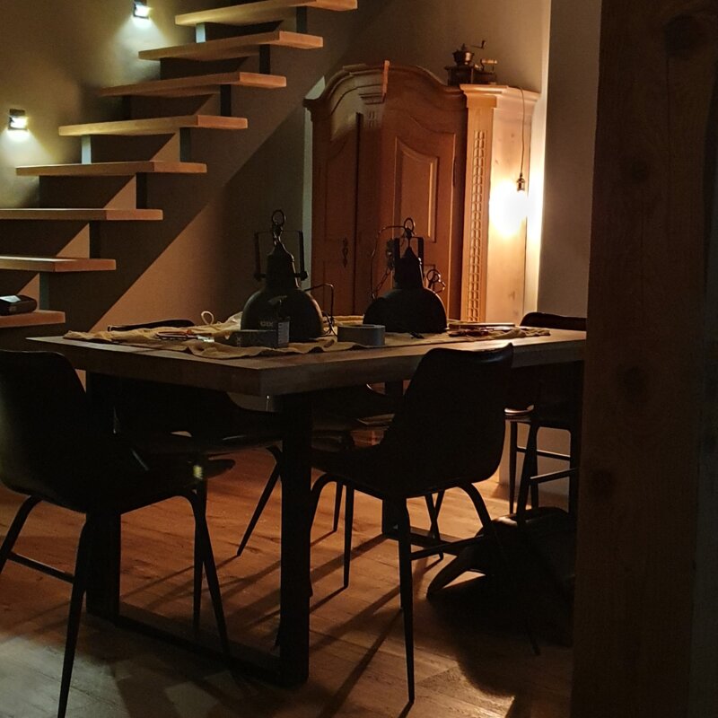 Dining area and stairs illuminated