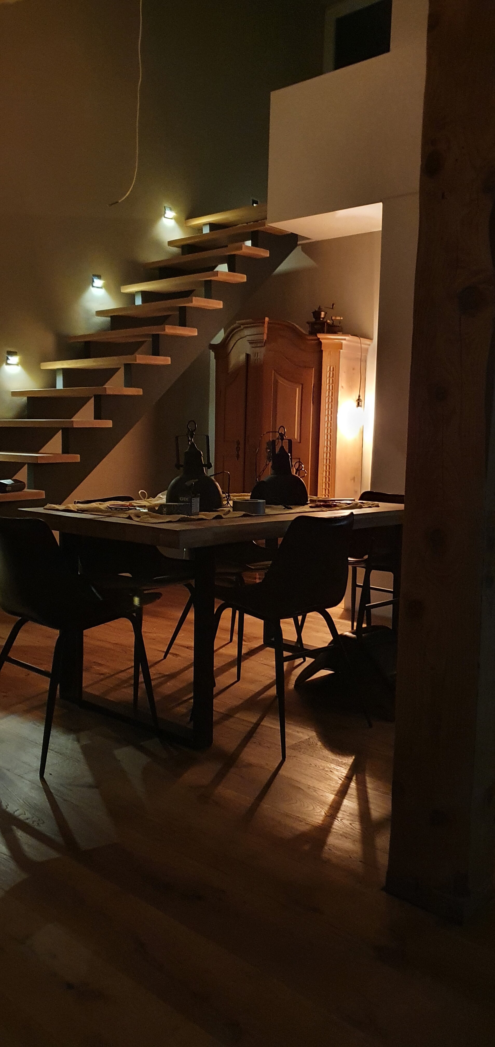 Dining area and stairs illuminated