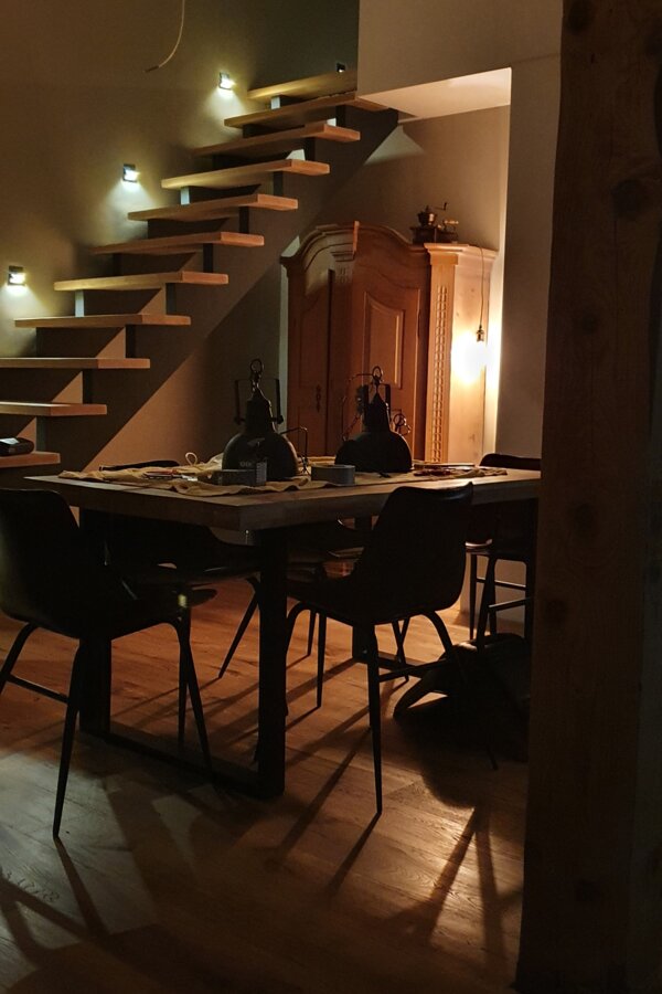 Dining area and stairs illuminated