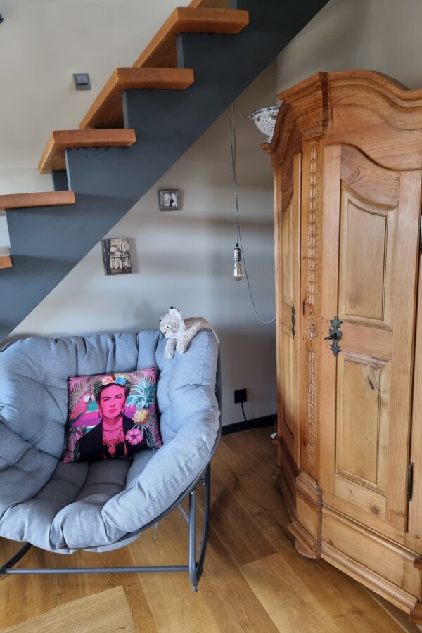 chair under the stairs