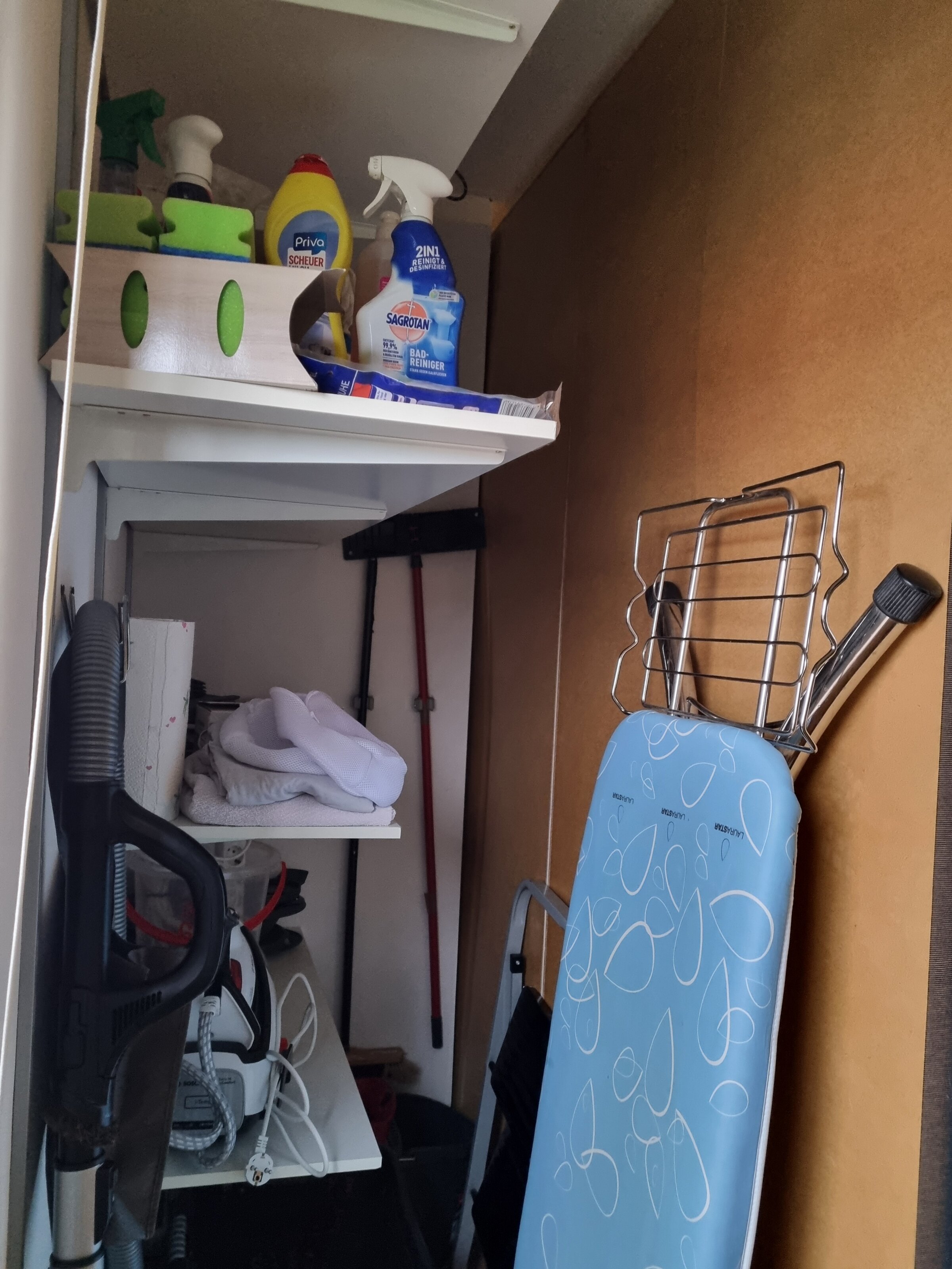 For vacuum cleaners, ironing board, - iron, broom, ...