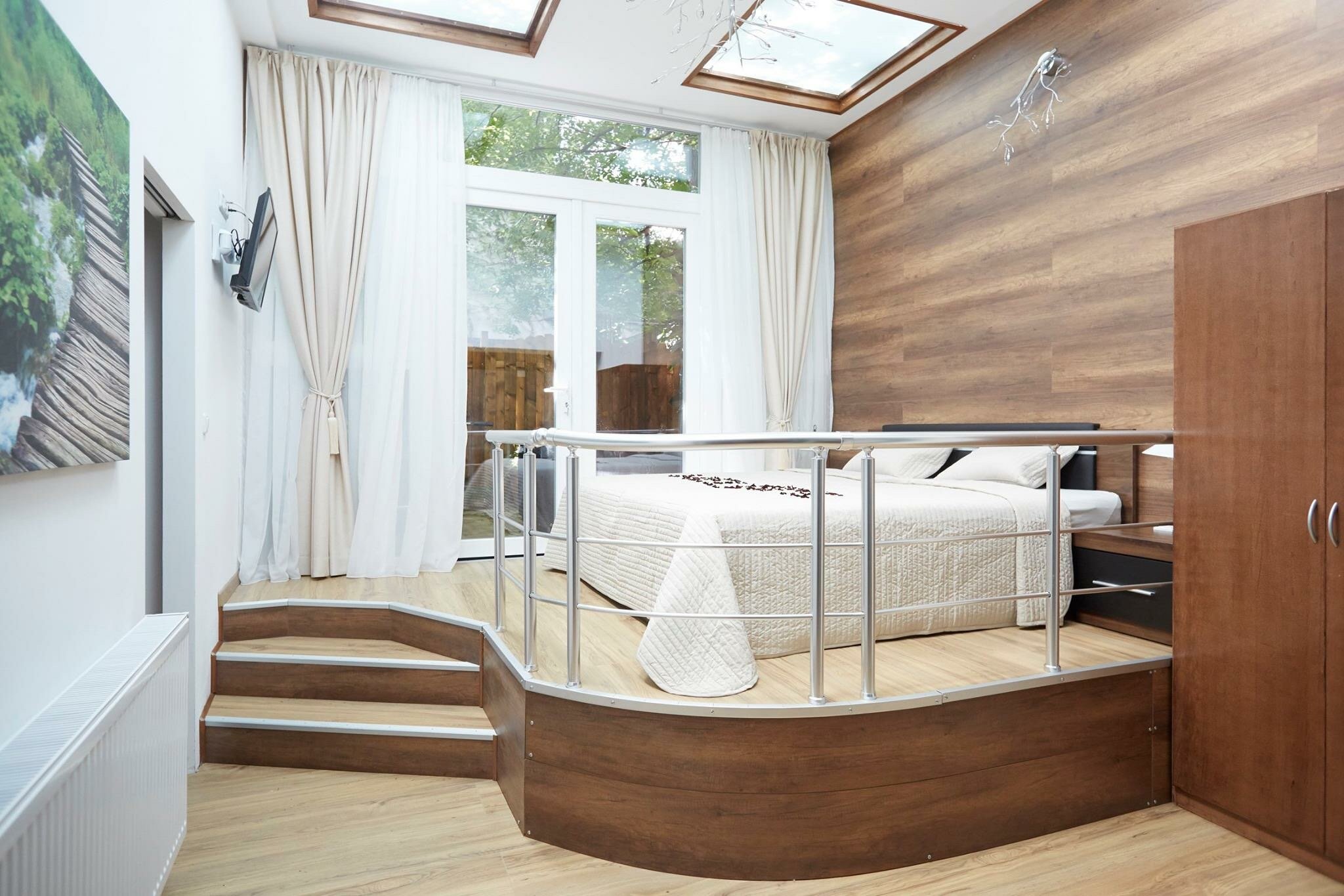 Platform bed, skylights & wood wall: 2-room apartment for short-term rental & temporary housing for 1 to 6 months in Vienna