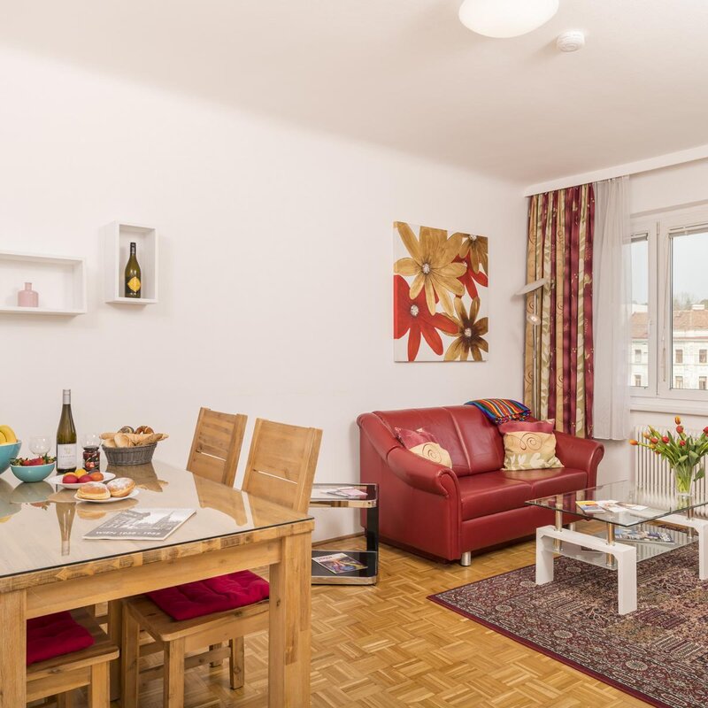Bright living-dining area of a furnished 2-room apartment – short-term rental & temporary housing for 1 to 6 months in Vienna