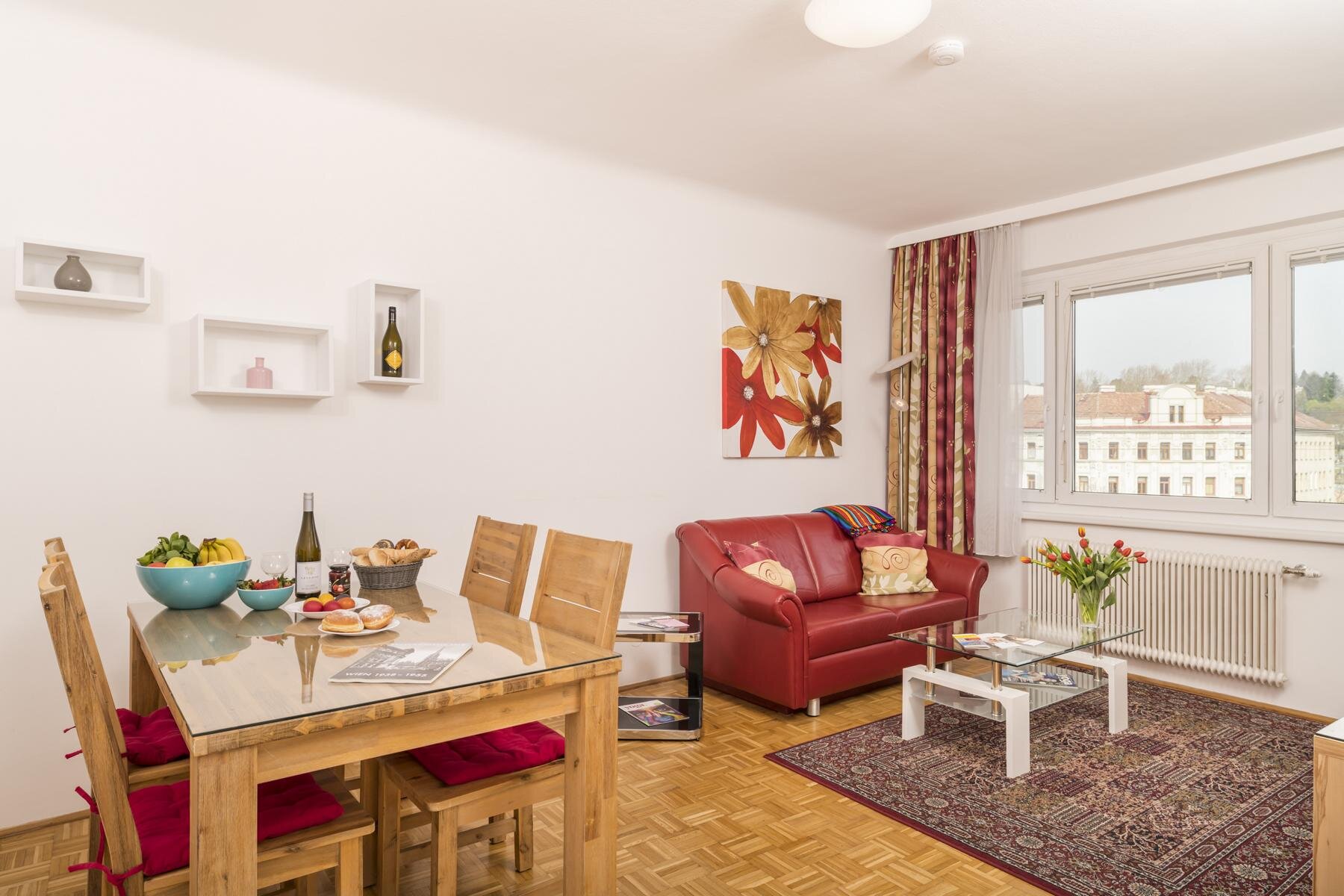 Bright living-dining area of a furnished 2-room apartment – short-term rental & temporary housing for 1 to 6 months in Vienna