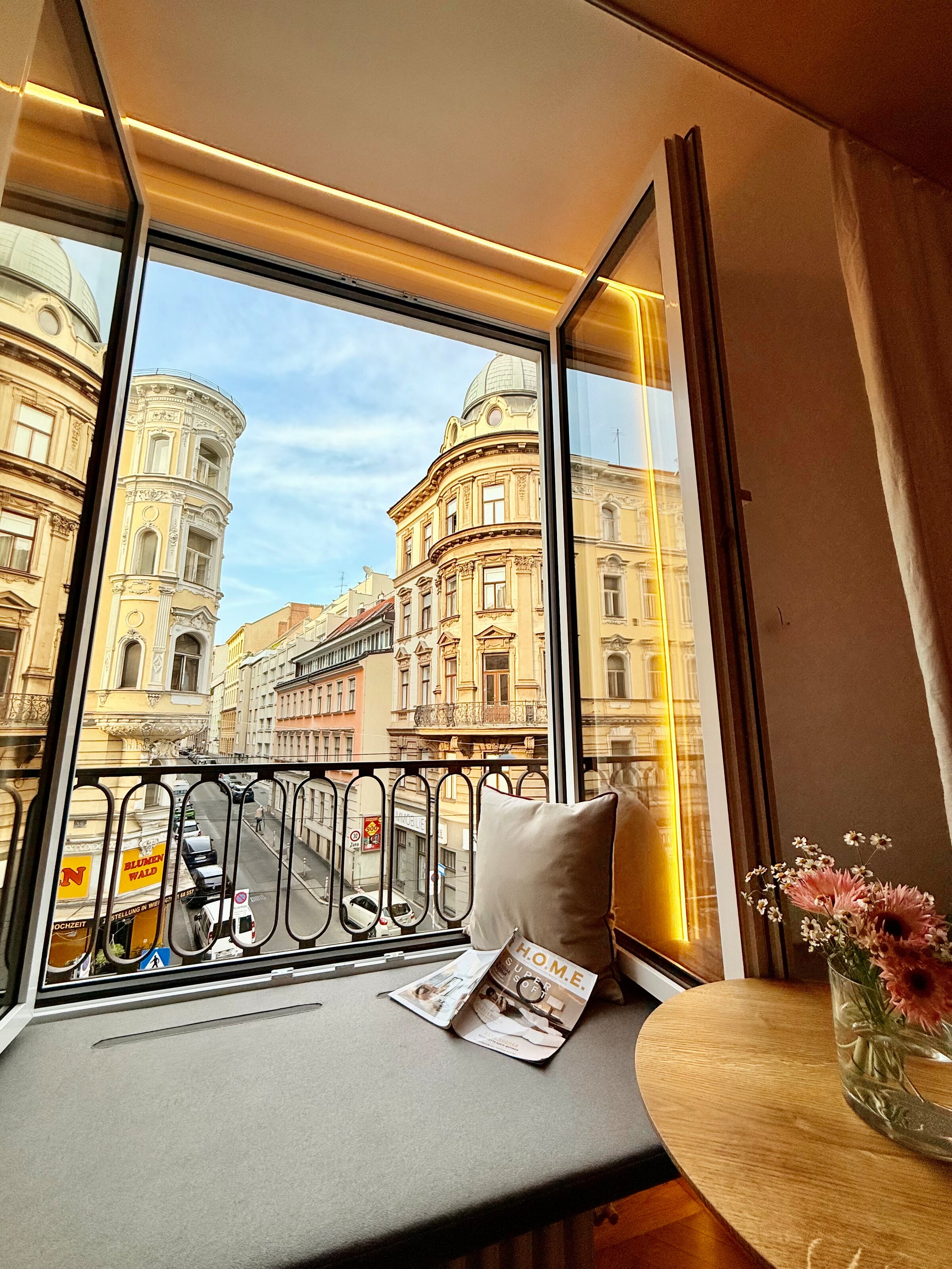 Reading bench with a view of the bustling Lerchenfelder Straße and the stylish buildings opposite