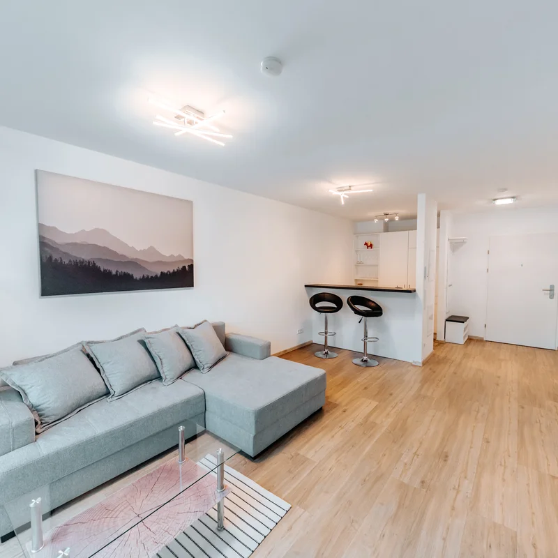 Wohnzimmer - KURZZEiTmiete - 2 Zimmer Wohnung Elsbethen - Salzburg | © OCNSMEDIA OG