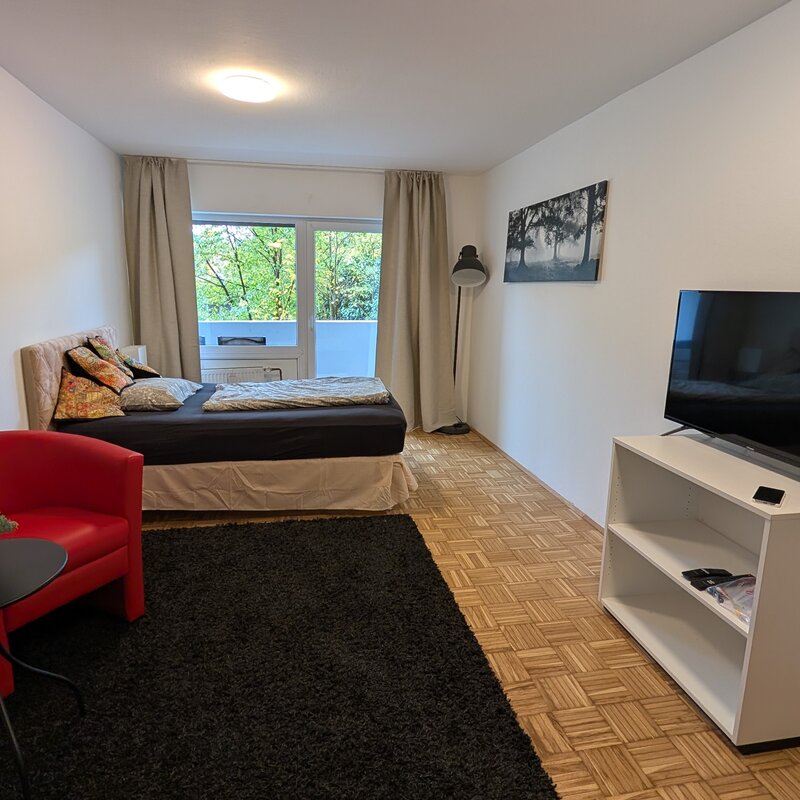 Furnished 1-room apartment with TV, armchair & parquet – short-term rental Salzburg, temporary housing for 1 to 6 months.