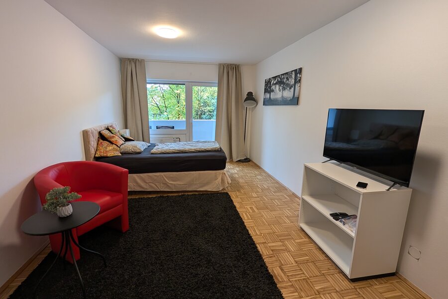 Furnished 1-room apartment with TV, armchair & parquet – short-term rental Salzburg, temporary housing for 1 to 6 months.