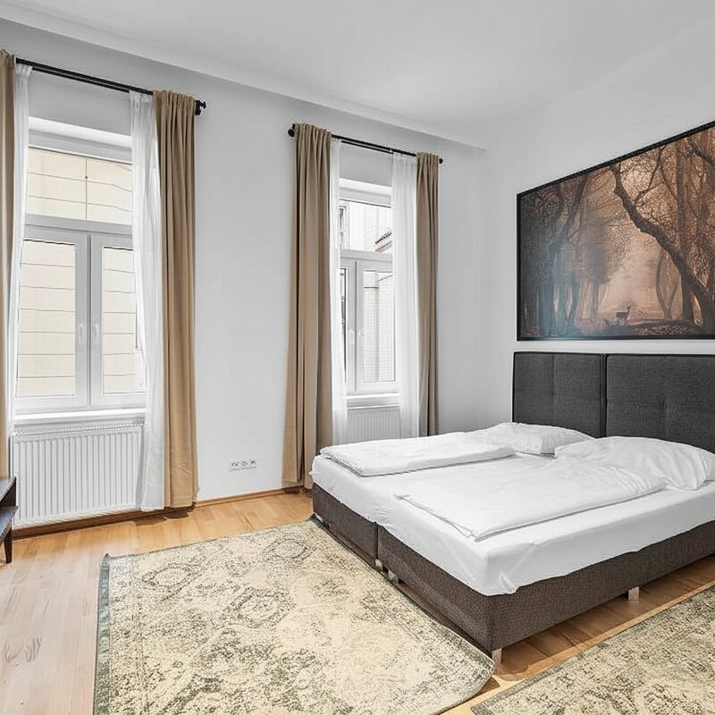 Helles Schlafzimmer mit Doppelbett & Parkett – 2-Zimmer Wohnung zur Kurzzeitmiete & Wohnen auf Zeit für 1 bis 6 Monate in Wien