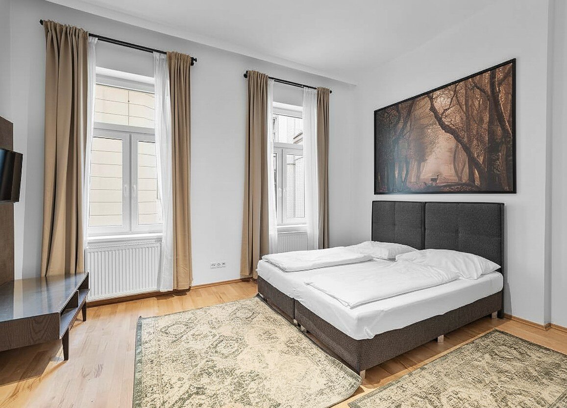 Helles Schlafzimmer mit Doppelbett & Parkett – 2-Zimmer Wohnung zur Kurzzeitmiete & Wohnen auf Zeit für 1 bis 6 Monate in Wien