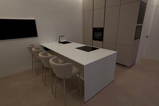 Die elegante Wohnküche kombiniert Design und Funktionalität – der integrierte Weinkühlschrank setzt ein exklusives Highlight und sorgt für stilvolle Genussmomente.