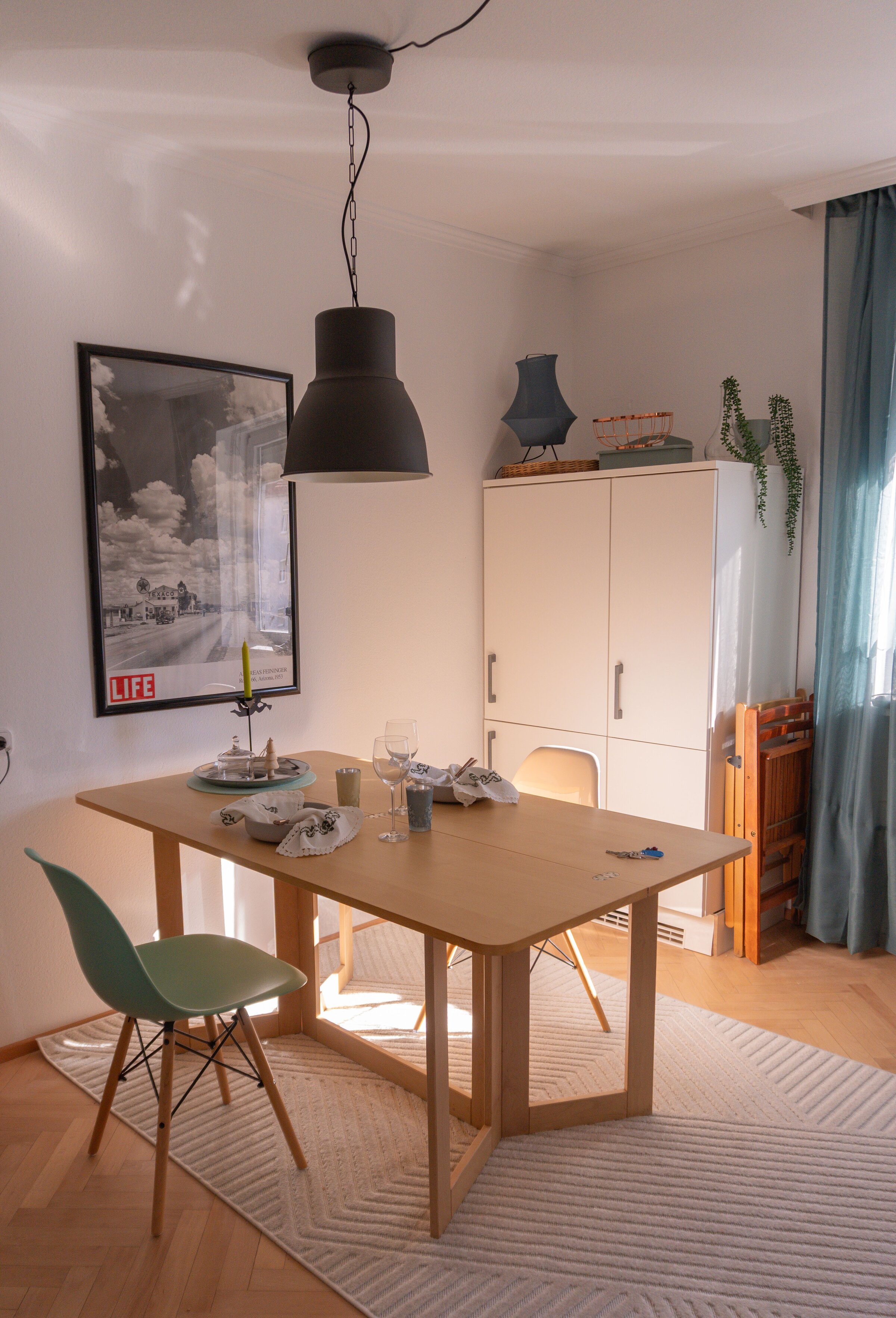 Refrigerator in the corner with utility cabinet (vacuum cleaner, ironing board, cleaning supplies)