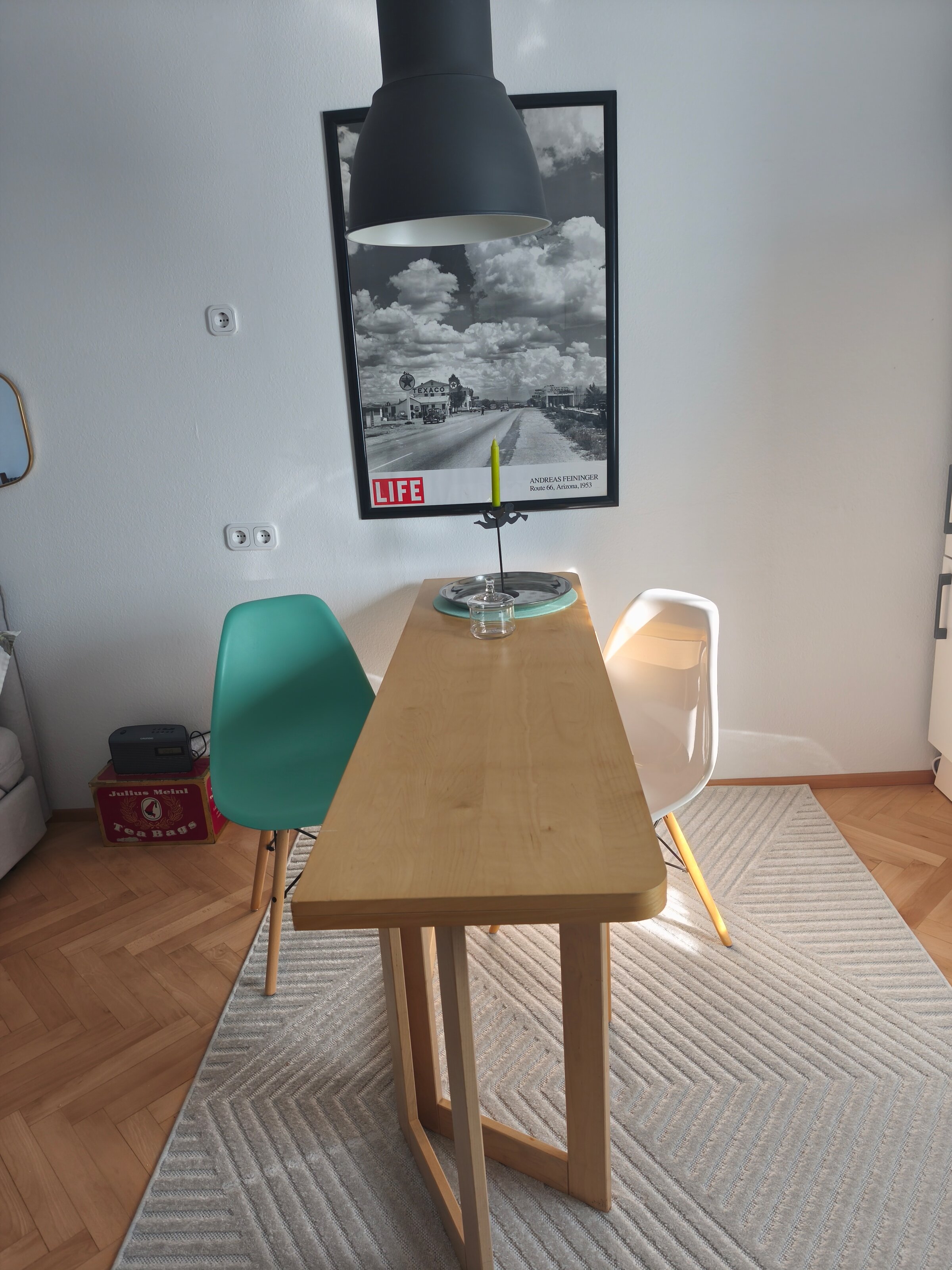 Folding table, two Eams chairs 