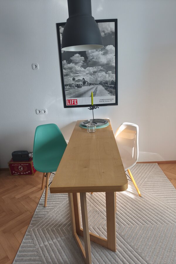 Folding table, two Eams chairs 