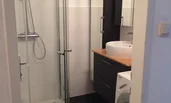 Without washing machine (But there is a washing machine for general use in the common basement.)