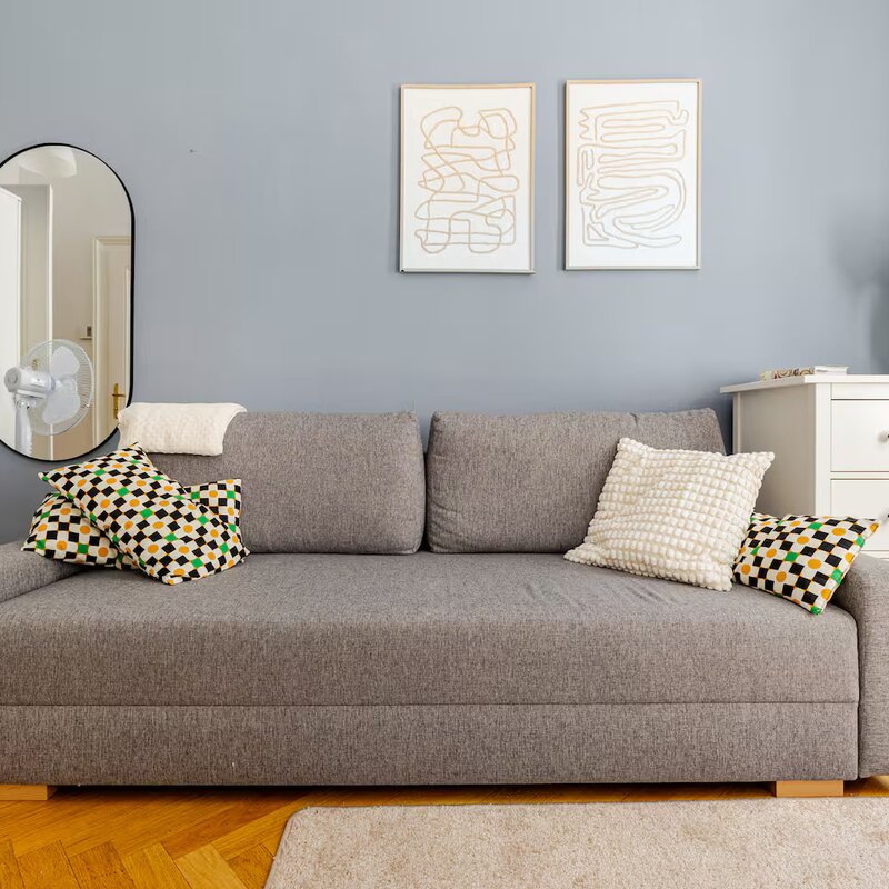 Bright living room with sofa bed & stylish decor – 1-room apartment for short-term rental & temporary housing for 1 to 6 months in Vienna