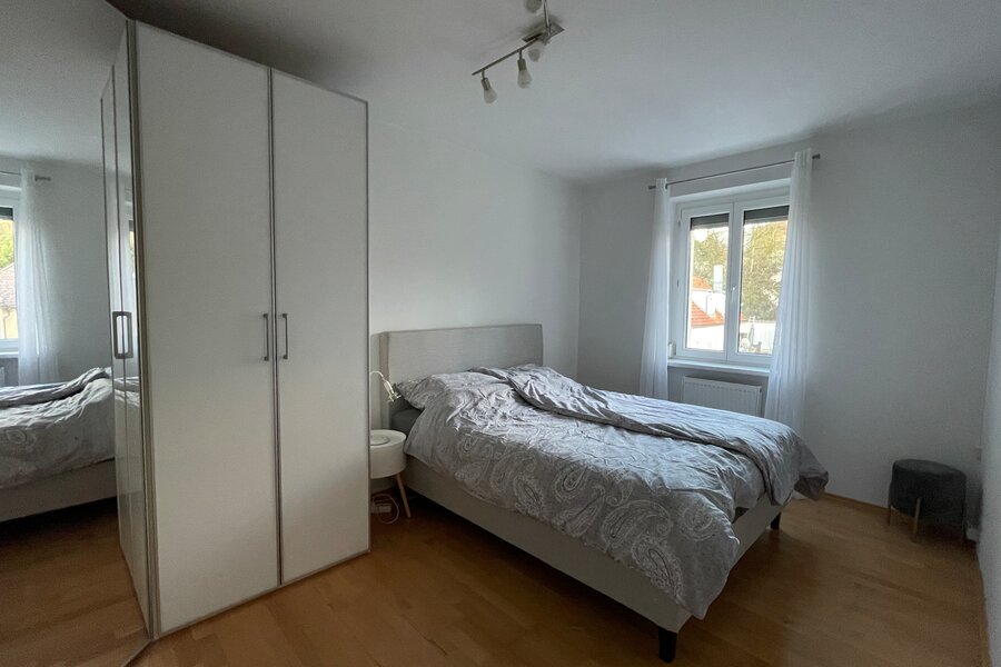 Bed and large corner wardrobe