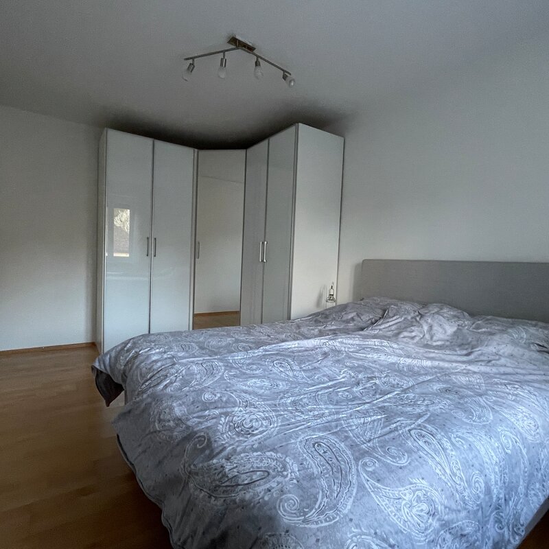 Bed and large corner wardrobe