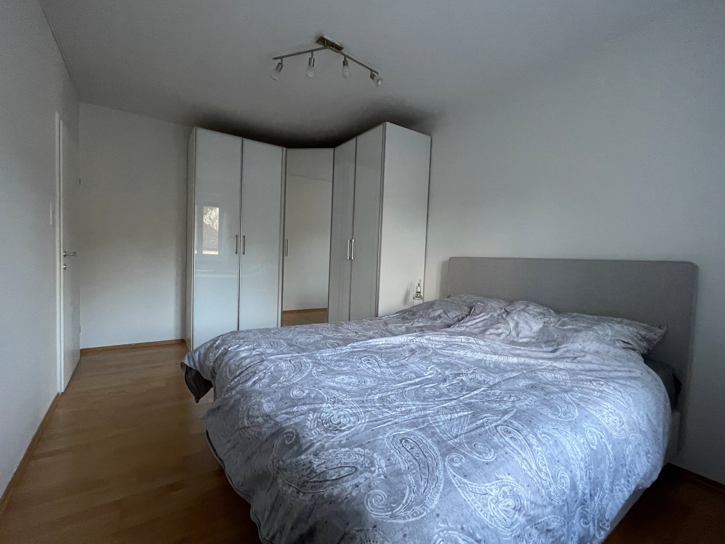 Bed and large corner wardrobe