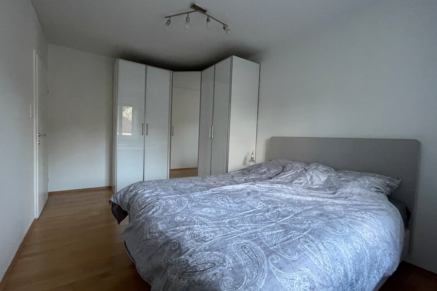 Bed and large corner wardrobe