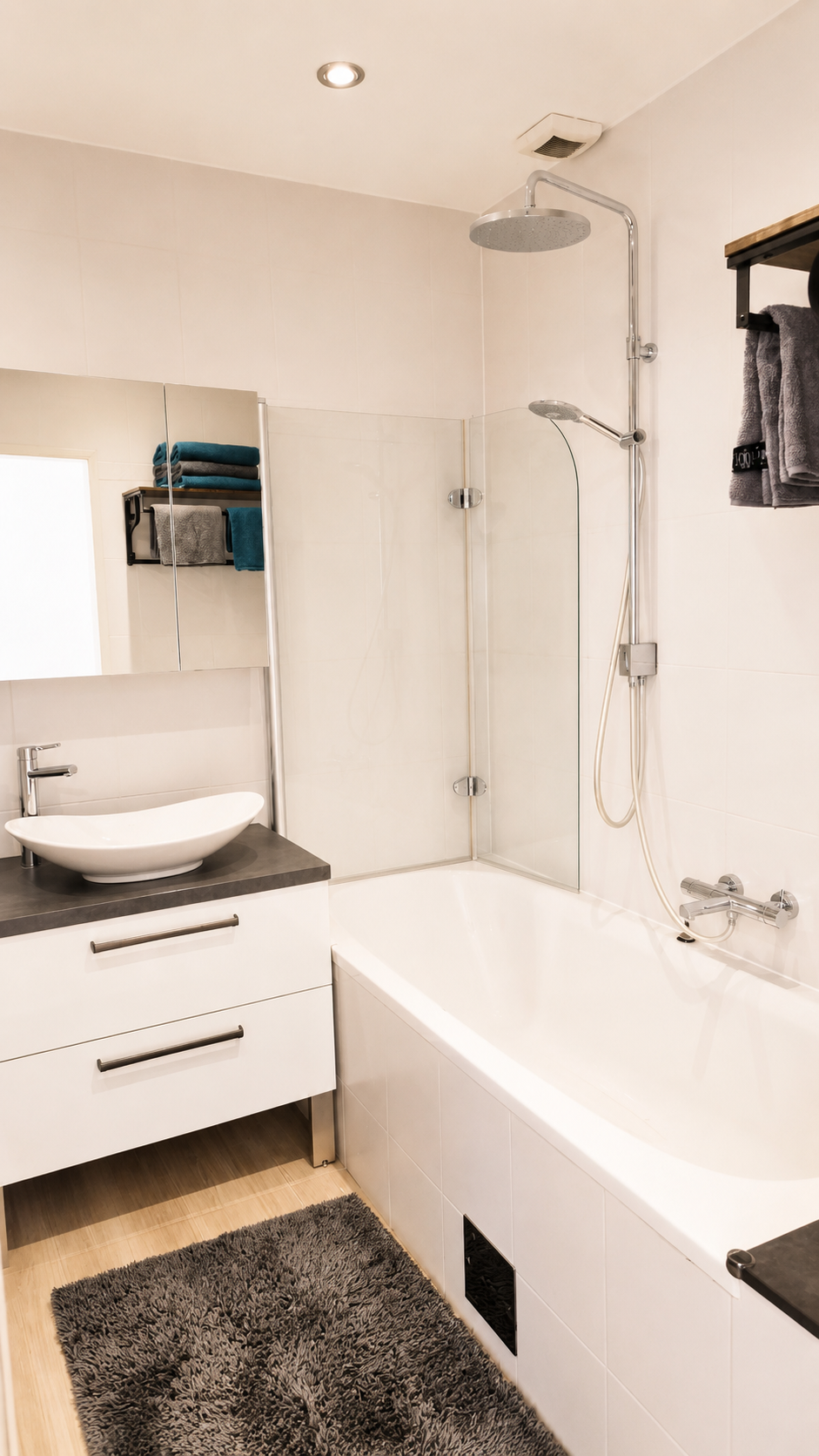 Bathroom with bathtub and rain shower