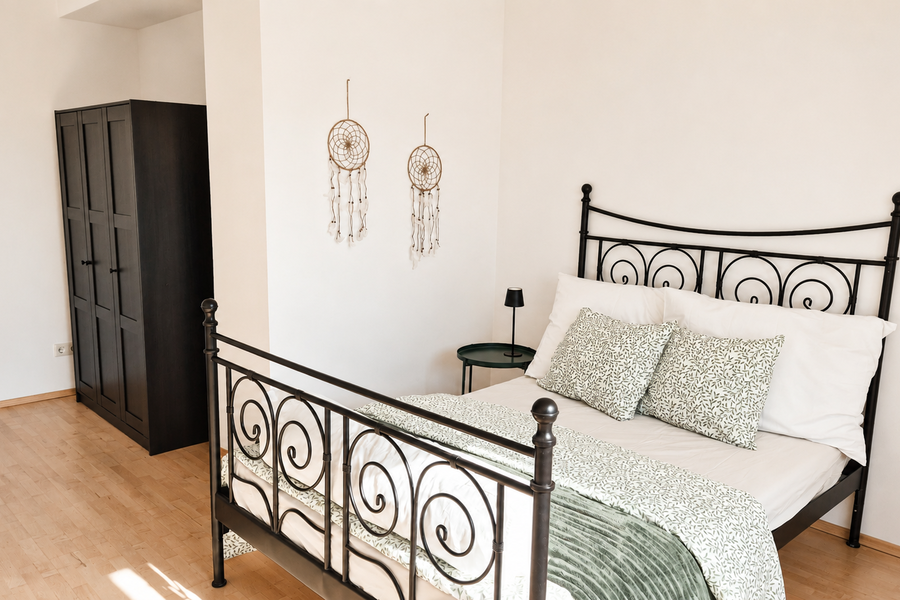 Bright bedroom with ample storage space | © privat