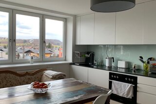 Spacious open-plan kitchen and living area as a shared common space