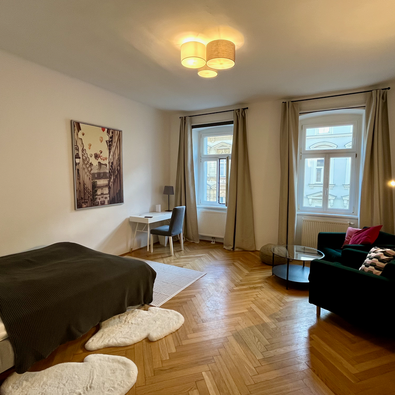 Furnished room with parquet & seating area – short-term rental & temporary housing for 1 to 6 months in Vienna