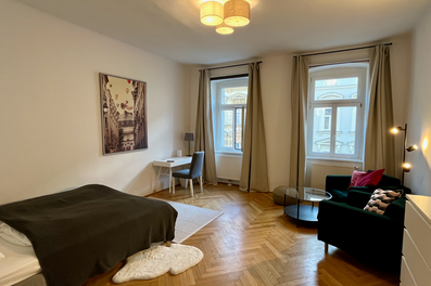 Furnished room with parquet & seating area – short-term rental & temporary housing for 1 to 6 months in Vienna