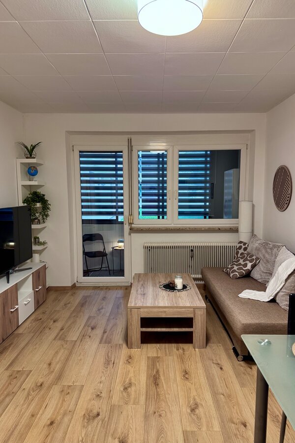 Bright living room with balcony – 2-room apartment for short-term rental & temporary housing for 1 to 6 months in Graz