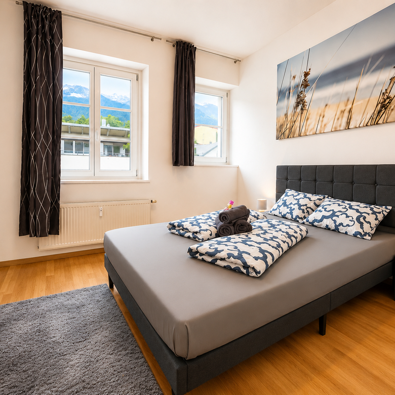 Bright bedroom with double bed & mountain view – 3-room apartment, short-term rental & temporary housing for 1 to 6 months, Innsbruck
