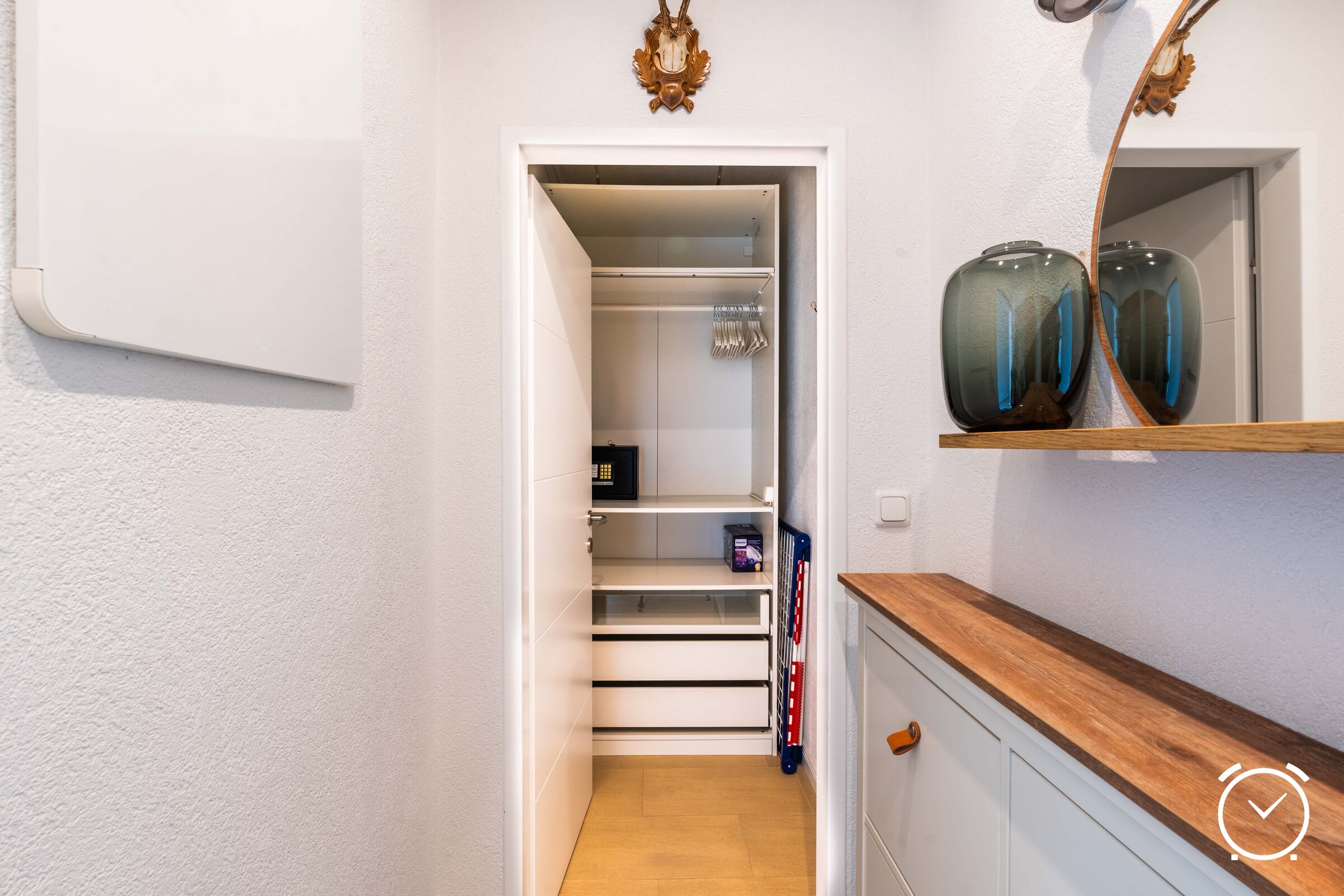 Walk-in closet, shoe cabinet, ironing board, iron, drying rack | © Anna Endres