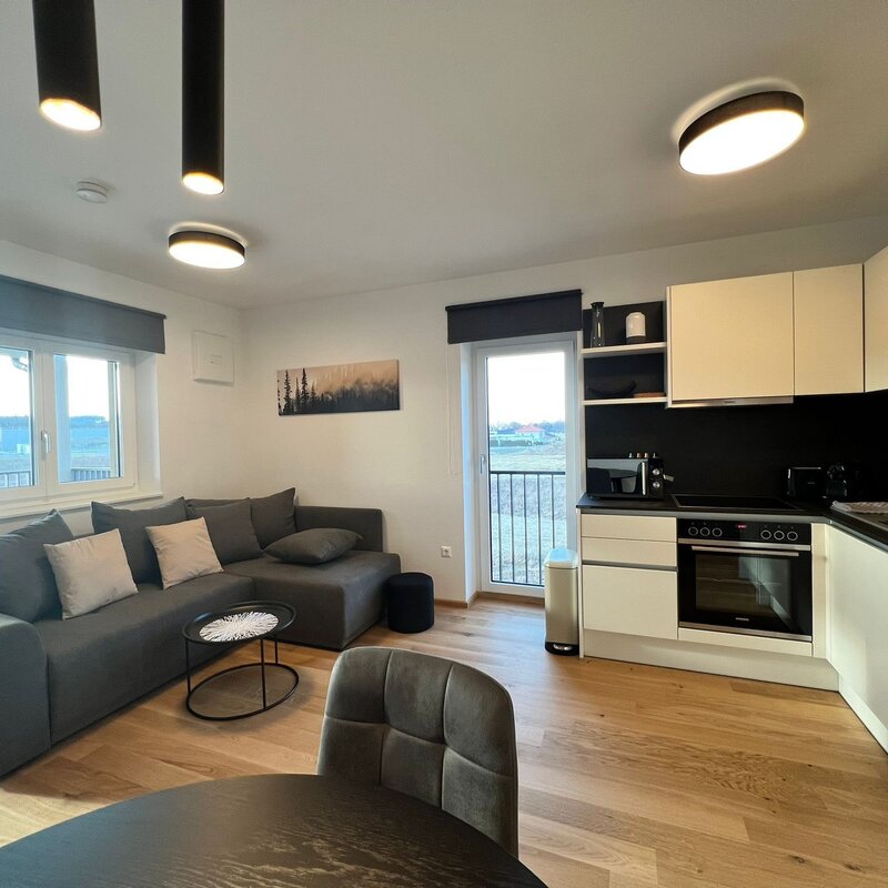 Bright open-plan living & kitchen with balcony – 2-room apartment, short-term rental & temporary housing for 1 to 6 months in St. Martin im Innkreis