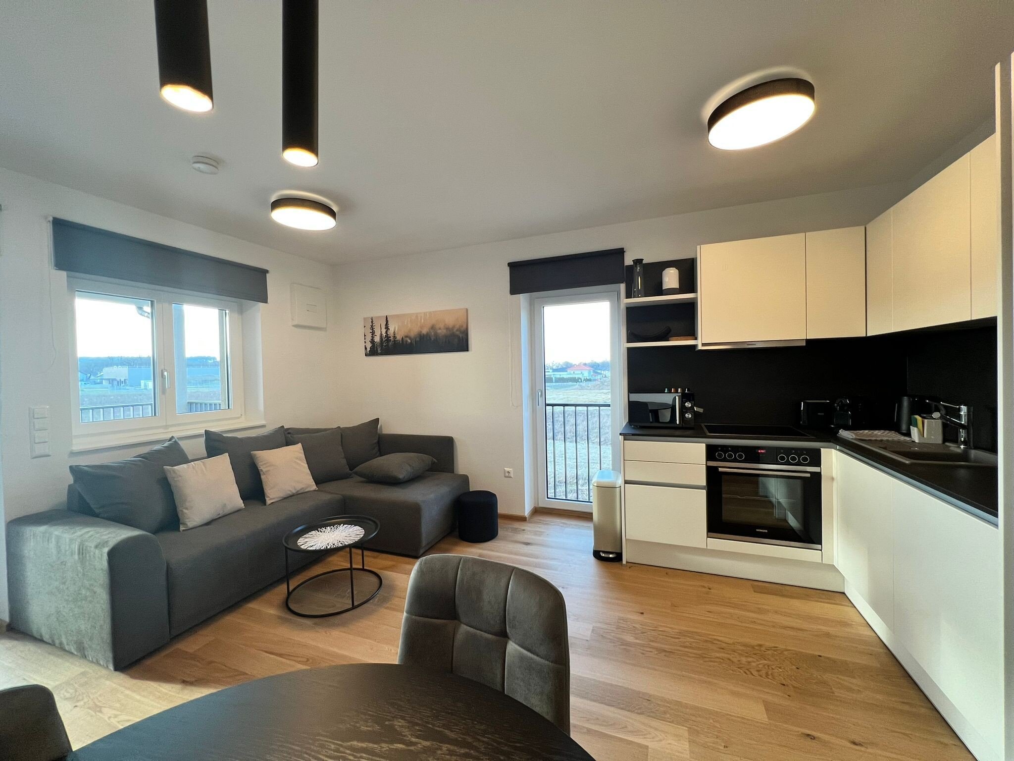 Bright open-plan living & kitchen with balcony – 2-room apartment, short-term rental & temporary housing for 1 to 6 months in St. Martin im Innkreis