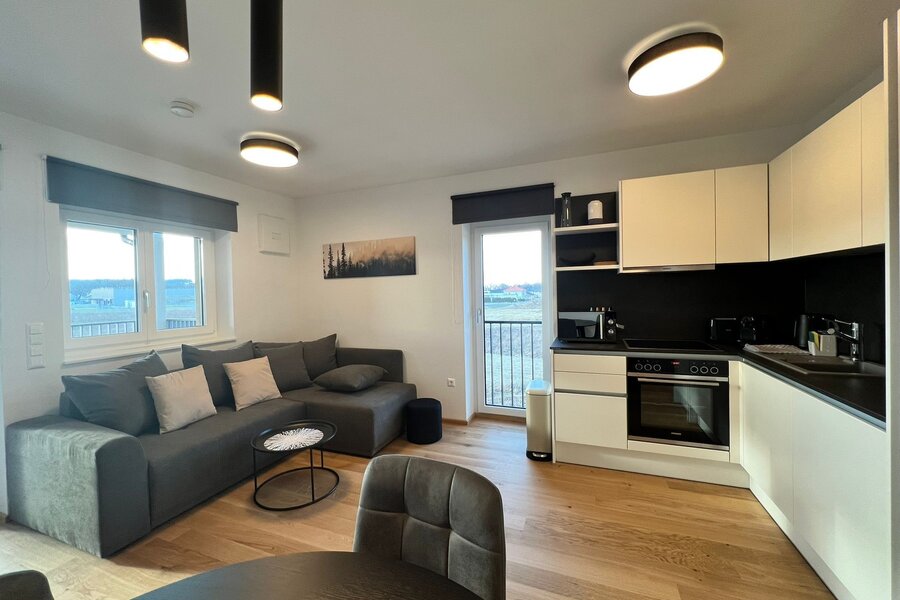 Bright open-plan living & kitchen with balcony – 2-room apartment, short-term rental & temporary housing for 1 to 6 months in St. Martin im Innkreis