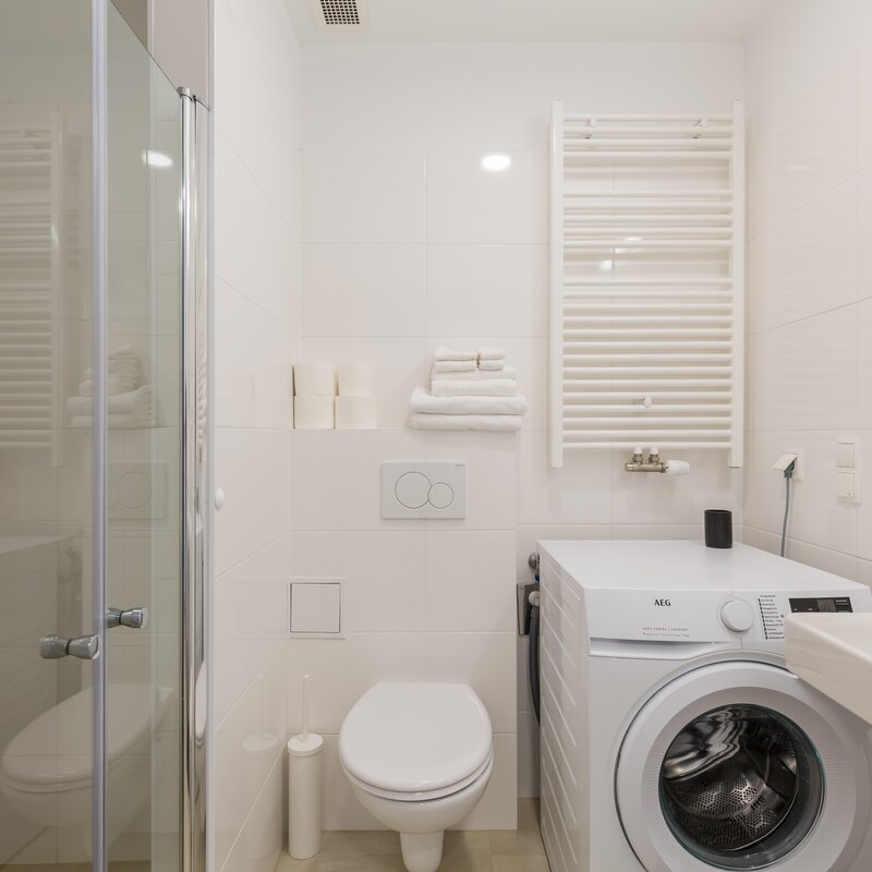 Bathroom, shower cabin, sink and washing machiene