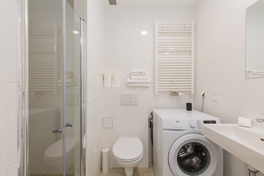 Bathroom, shower cabin, sink and washing machiene