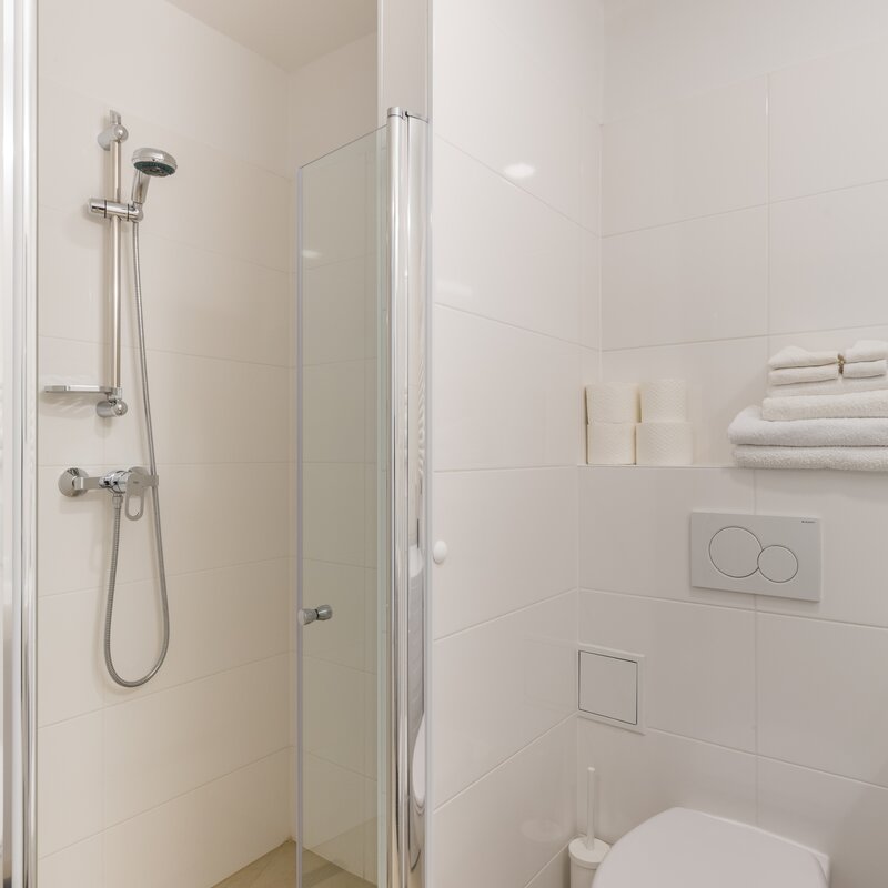 Bathroom with shower cabin and toilet 