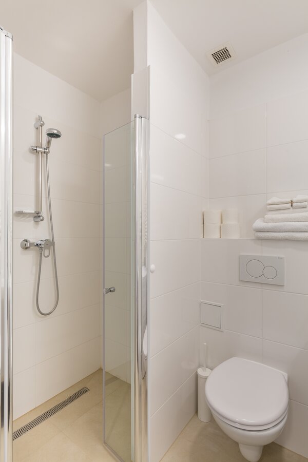 Bathroom with shower cabin and toilet 