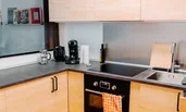 Kitchen with window-wide hatch