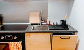 Kitchen with window-wide hatch