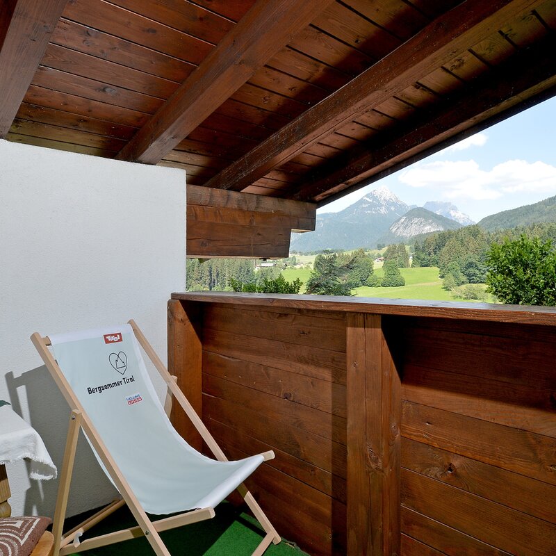 Balcony with mountain panorama – 2-room apt, short-term rental & temporary housing for 1 to 6 months in Schwoich