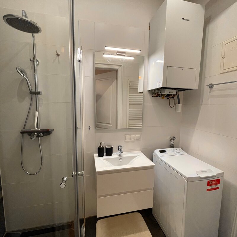 Bathroom with washing machine & rain shower