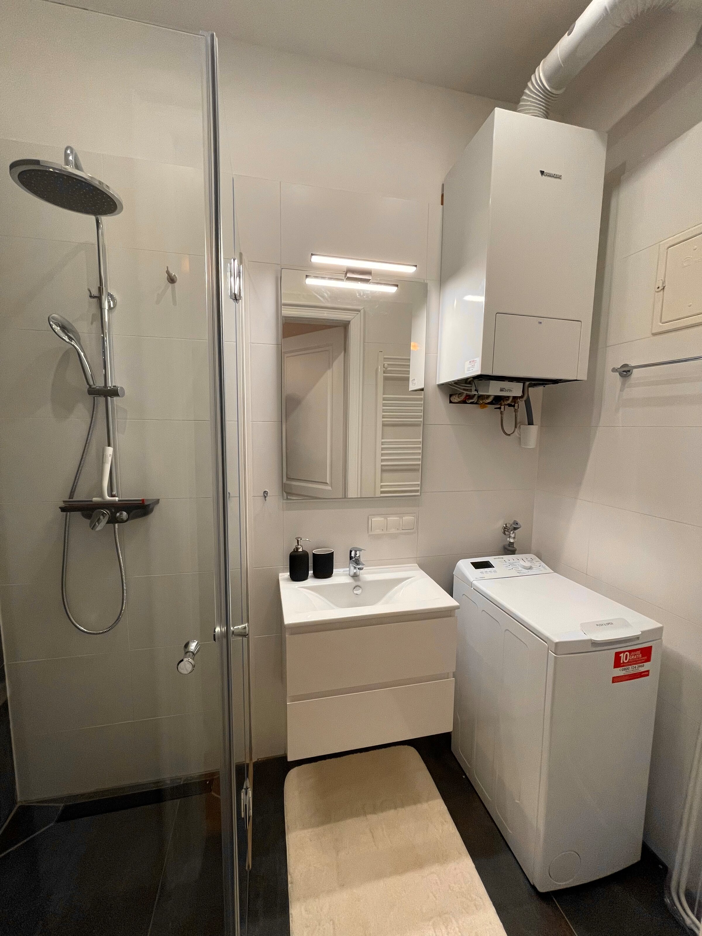 Bathroom with washing machine & rain shower