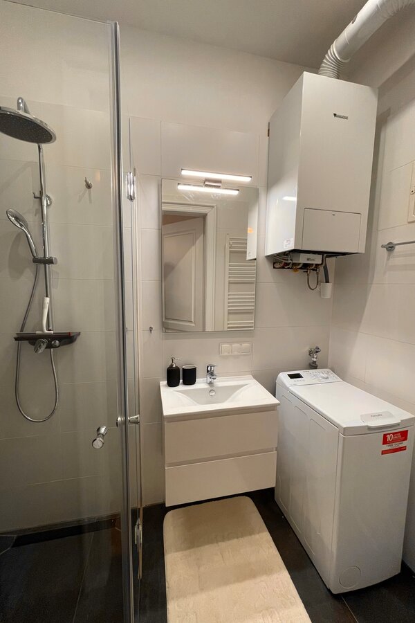 Bathroom with washing machine & rain shower