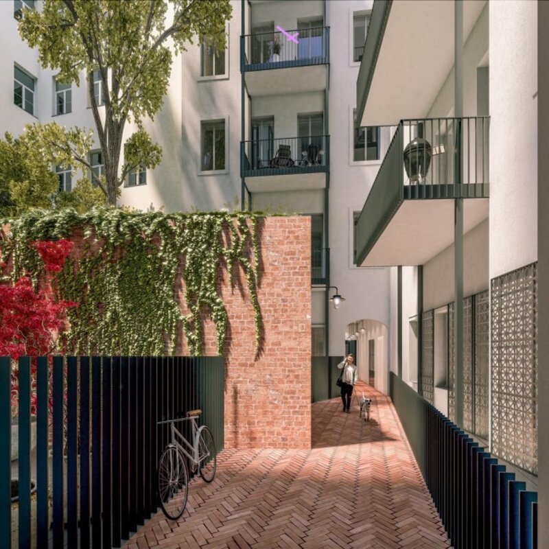 Innenhof mit Baum, Fahrrad-Aufbewahrungs-Raum und automatischer Beleuchtung | © Malek Herbst Architects