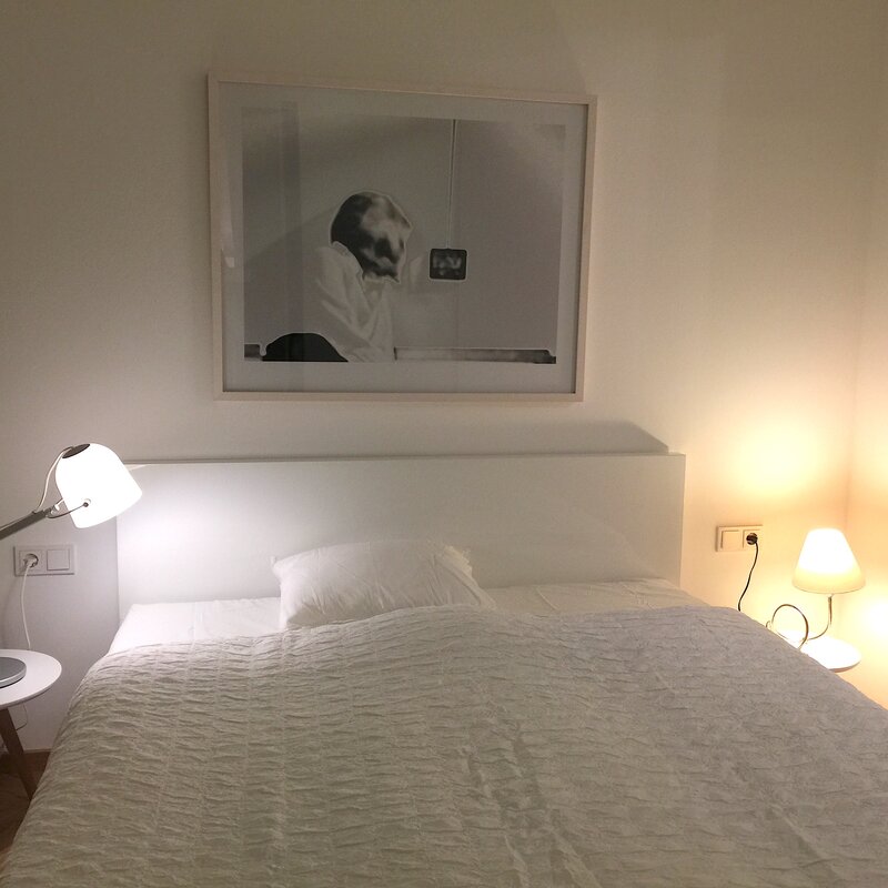 Sleeping room with table lamps, Double bed with Art Work