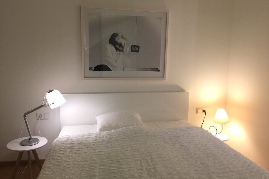 Sleeping room with table lamps, Double bed with Art Work